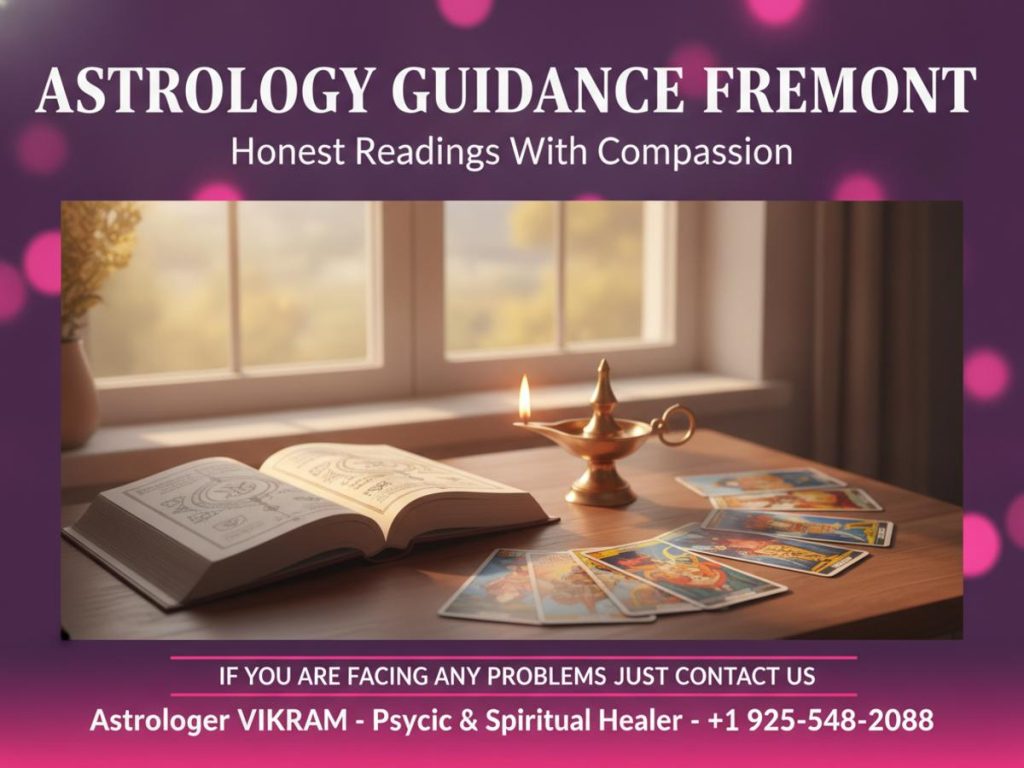 Vedic astrology book and tarot cards on desk warm light Fremont CA astrologer