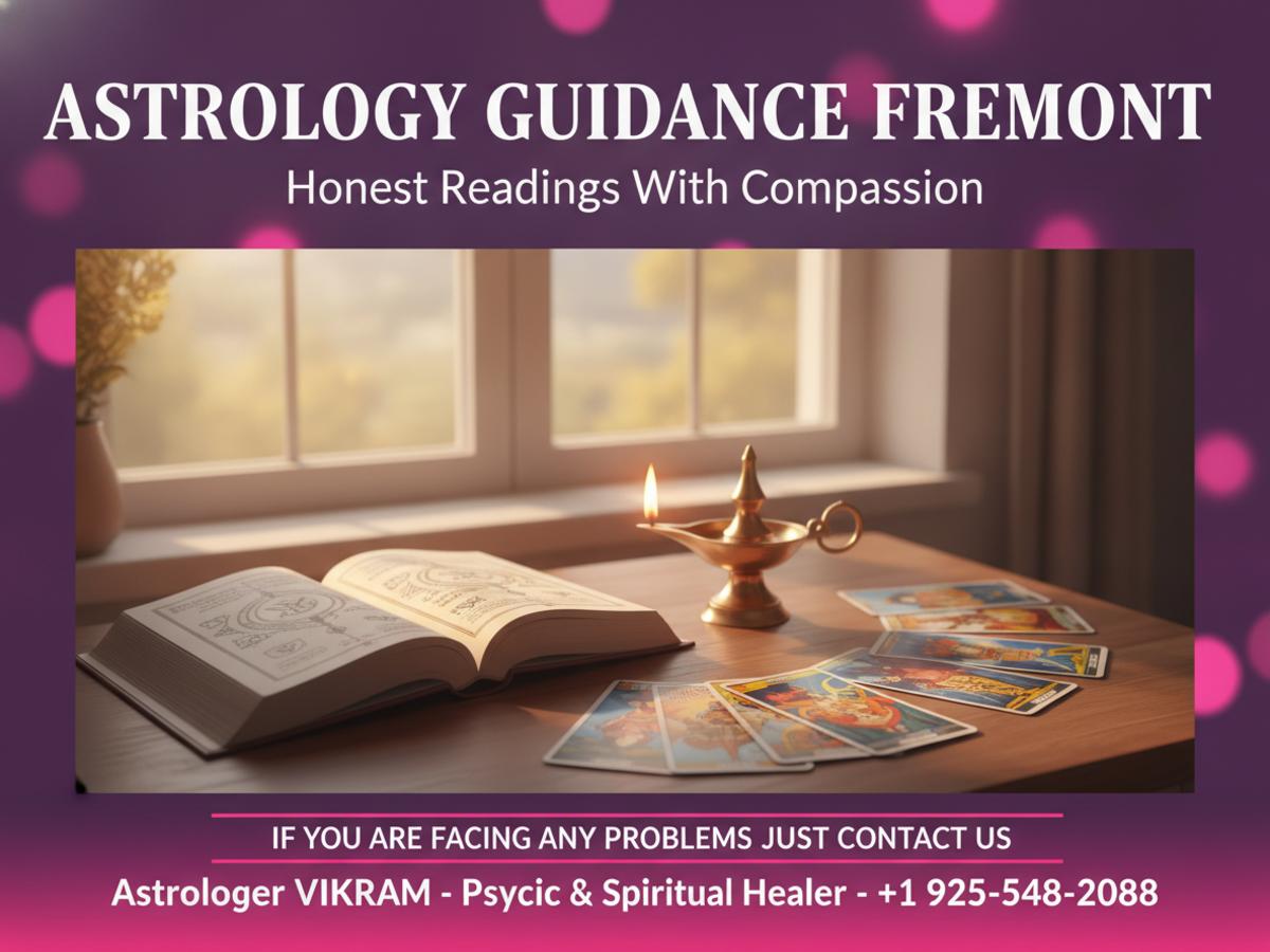 How an Astrologer in Fremont, CA Can Help You Find Clarity Vedic astrology book and tarot cards on desk warm light Fremont CA astrologer